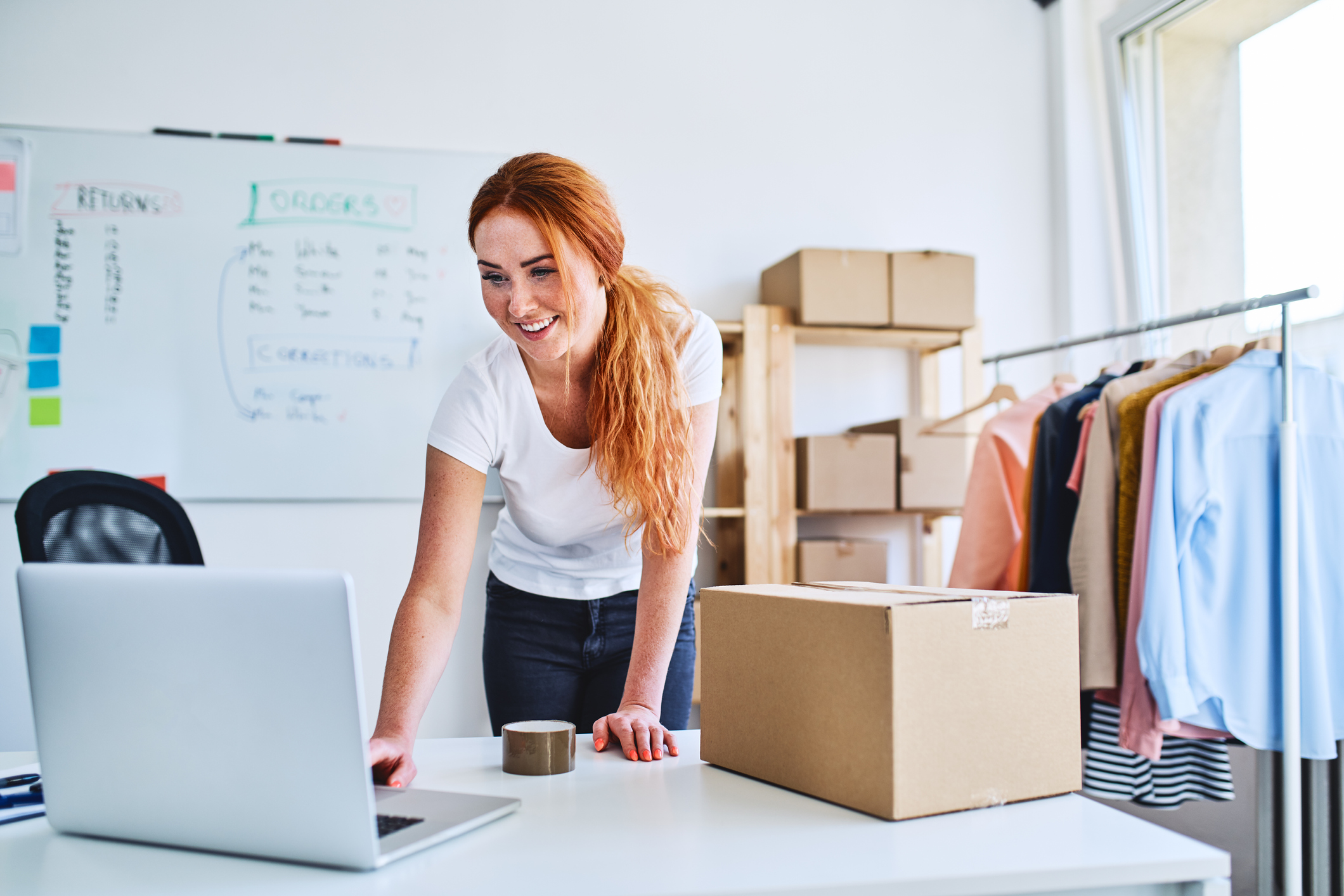 A business owner prepares deliveries for clients.