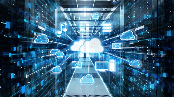 A cloud in the middle of a data center that's connected to multiple wireless devices.
