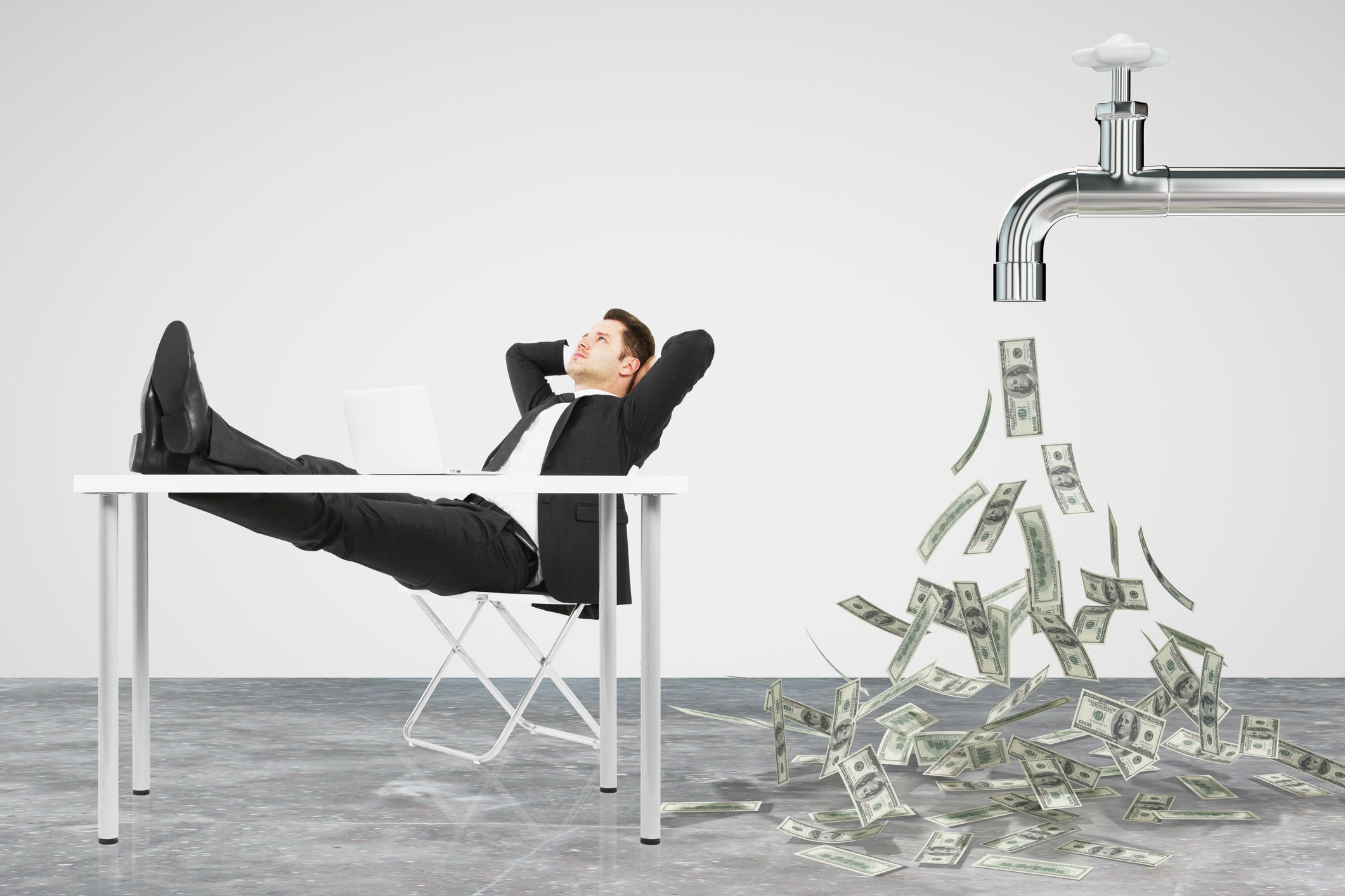 Businessman sitting with his feet propped up on table and money flowing out of a giant faucet behind him