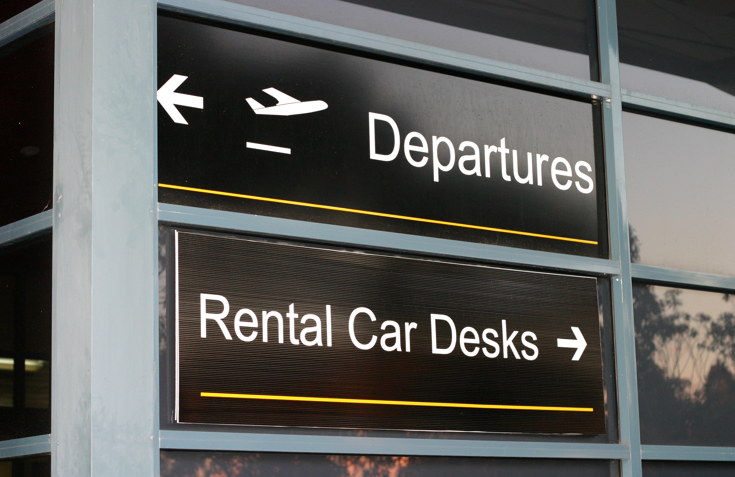 Rental car desk sign at airport