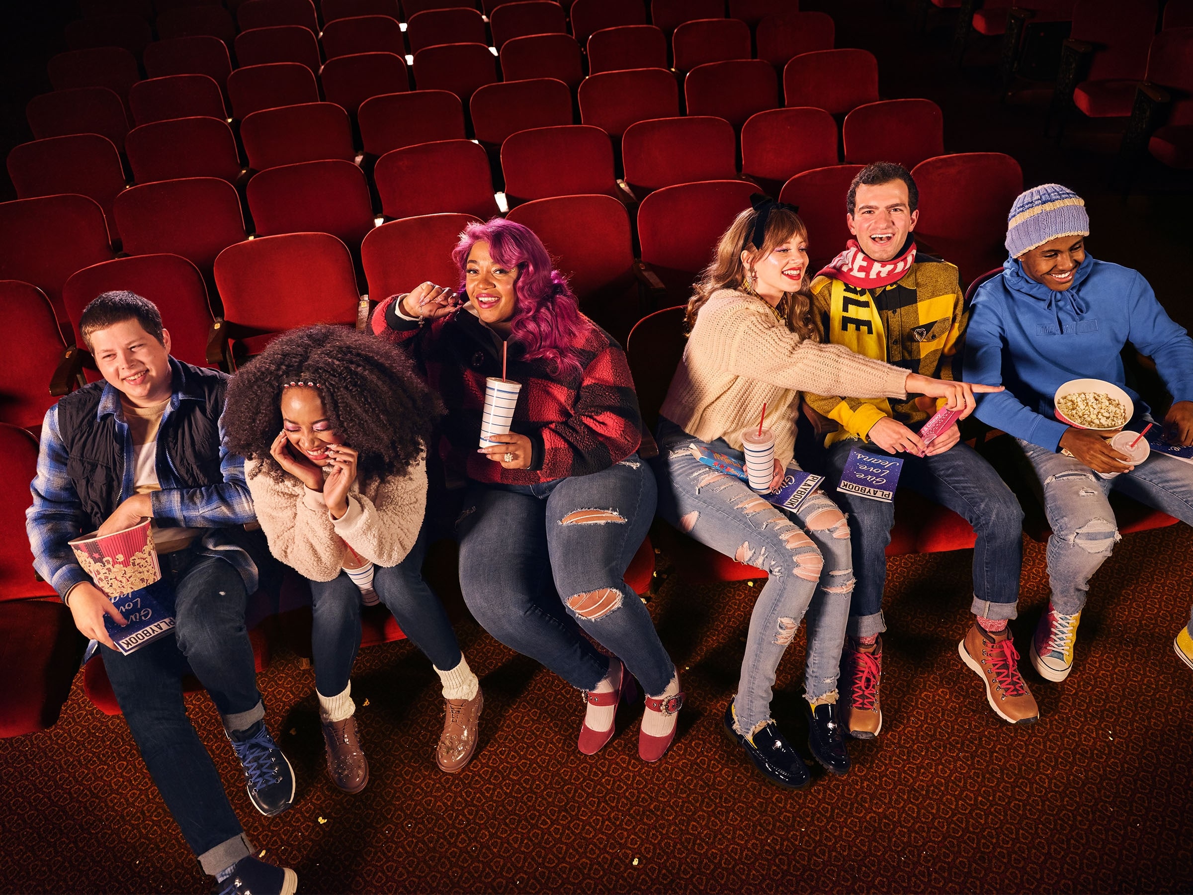 Teens at a movie theater wearing American Eagle Outfitters clothing.