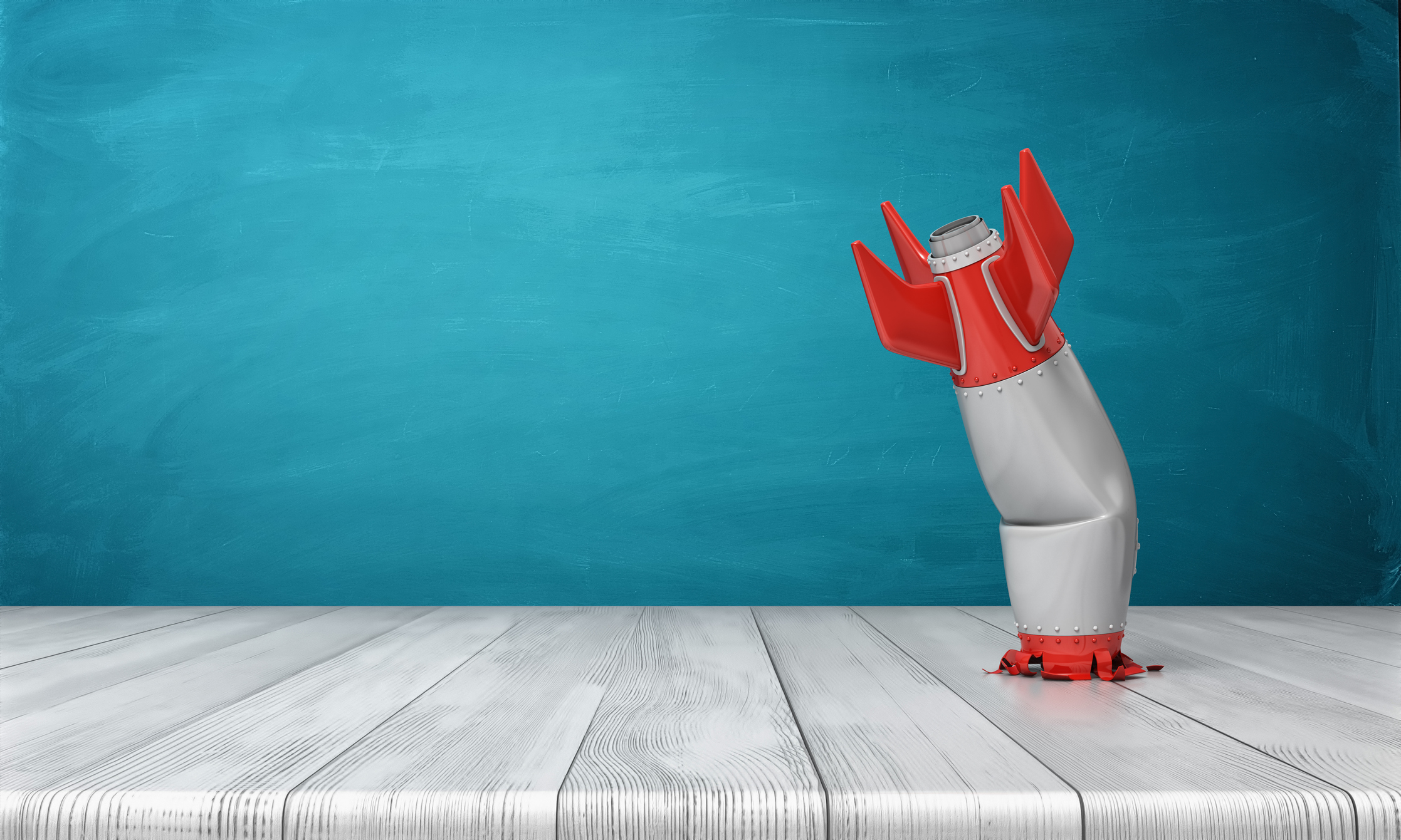 A toy rocket crashed into a table.