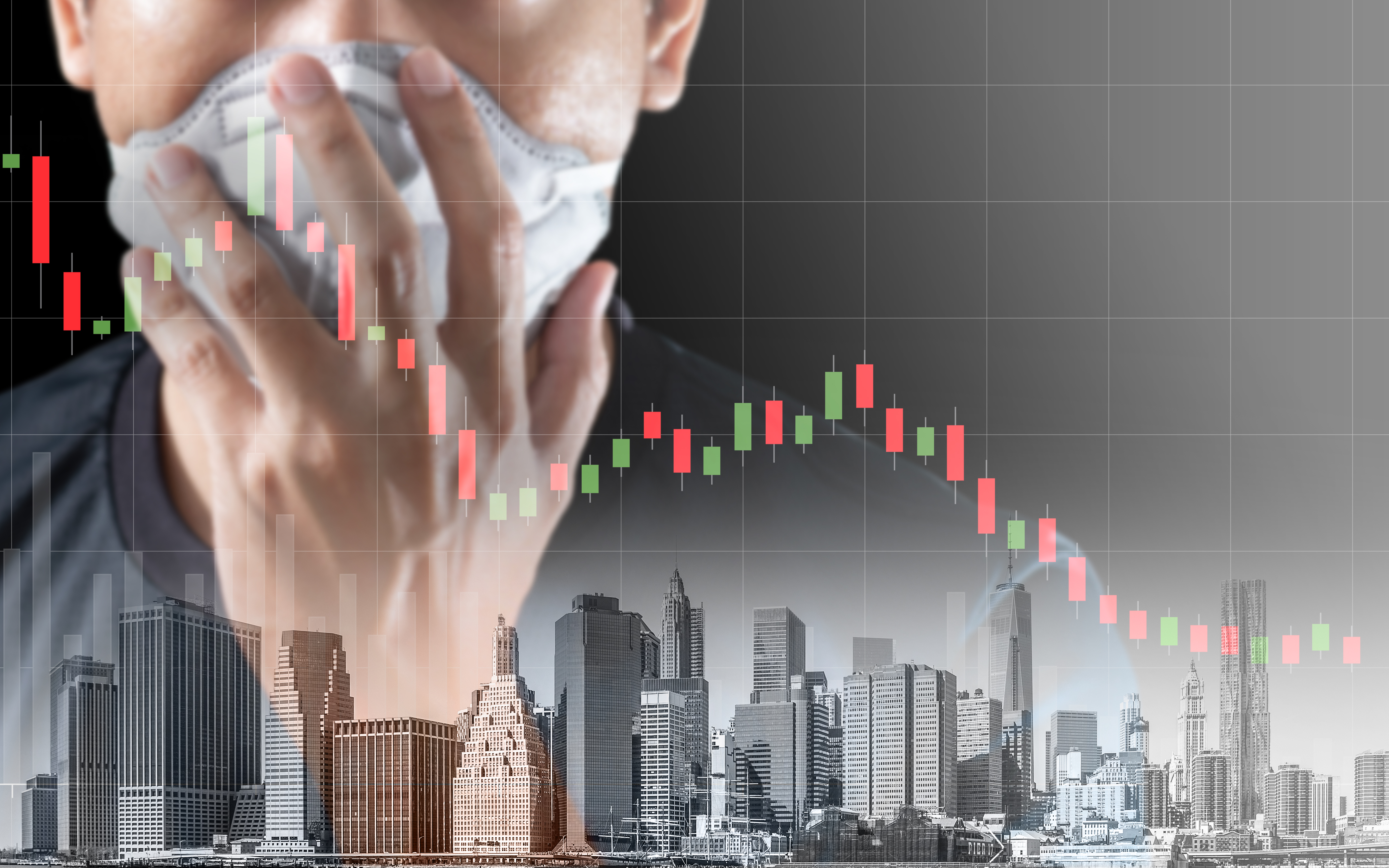 investor with mask over falling stock prices.
