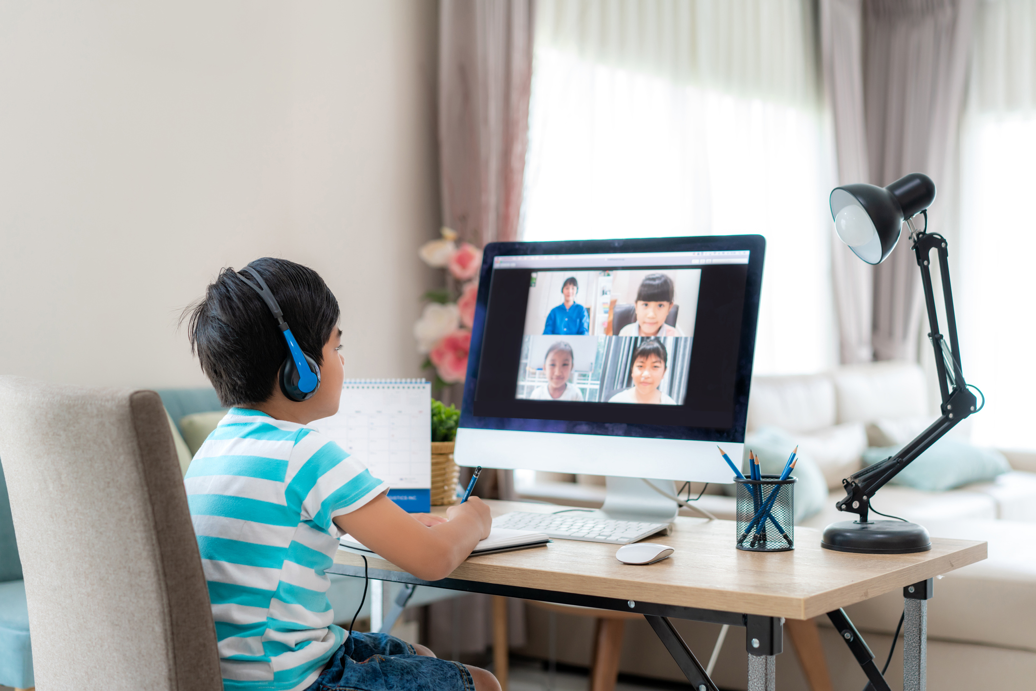 A child at a computer.