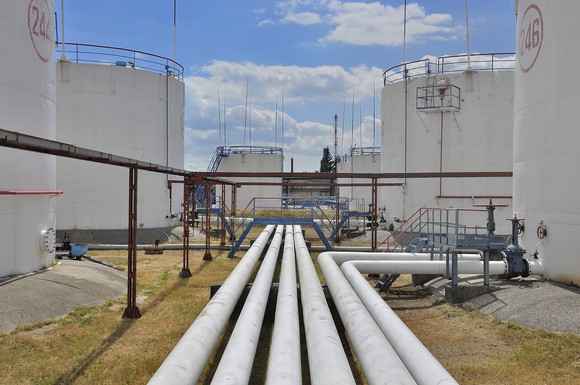 An assortment of pipelines leading to individual storage tanks. 
