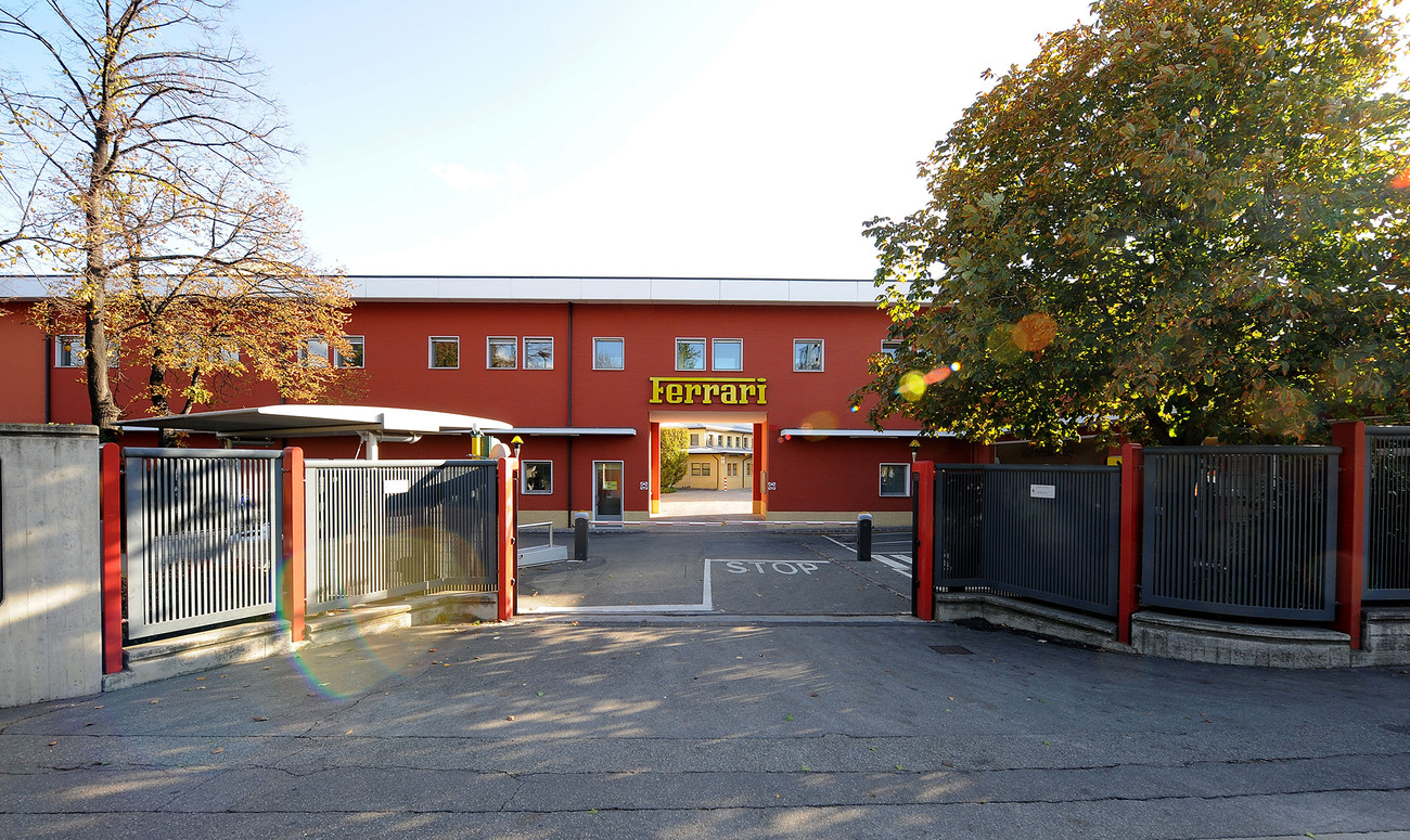 A Ferrari sign on an entrance to a building