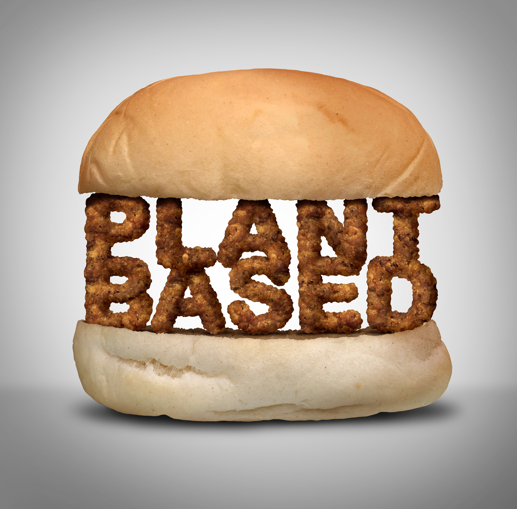 A bun with the words "PLANT BASED" sandwiched in between the two slices.