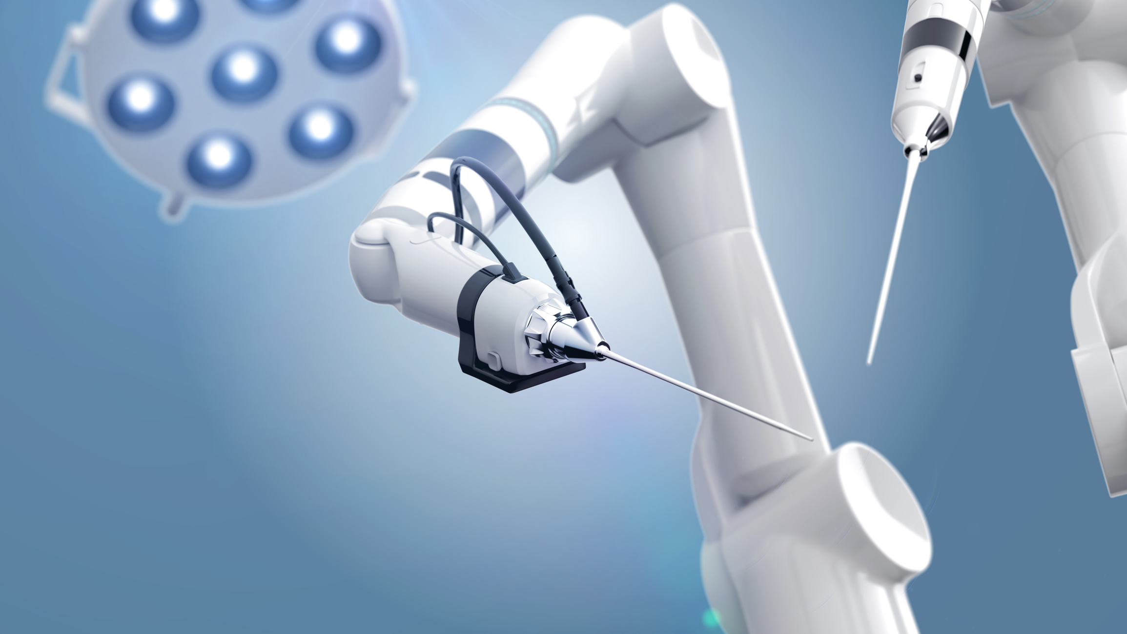 Medical robot arms viewed from an operating table's angle