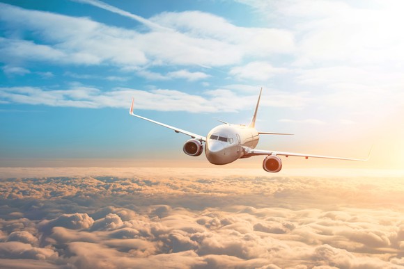 An airplane flying over clouds 