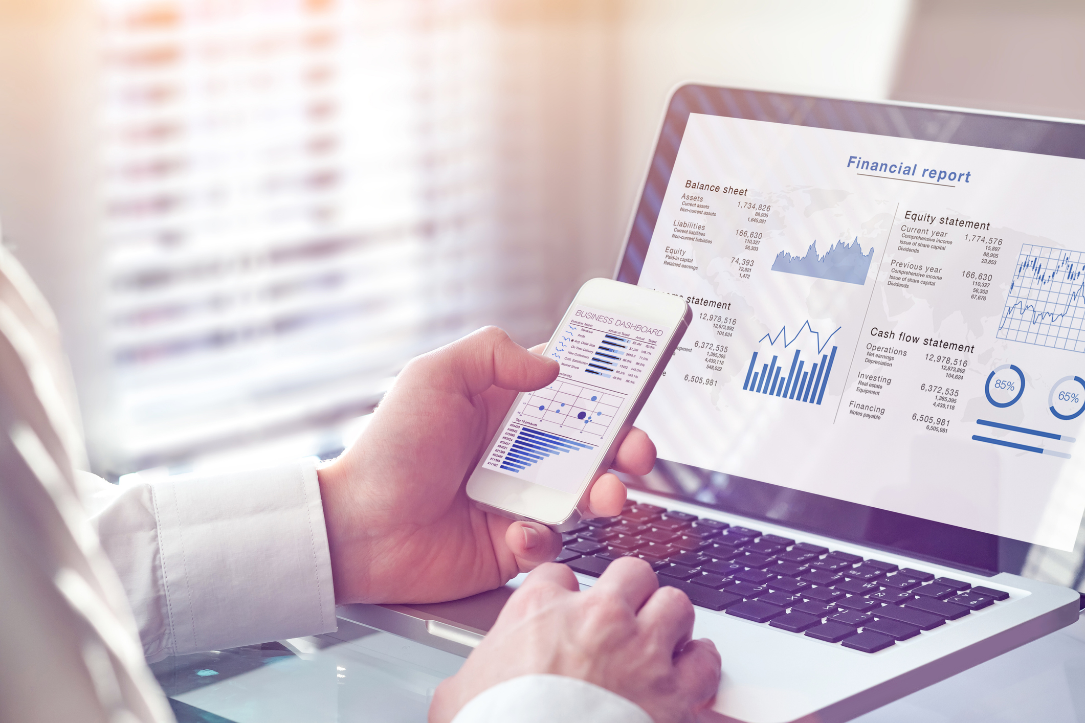 A person consults a dashboard detailing their financial investments.