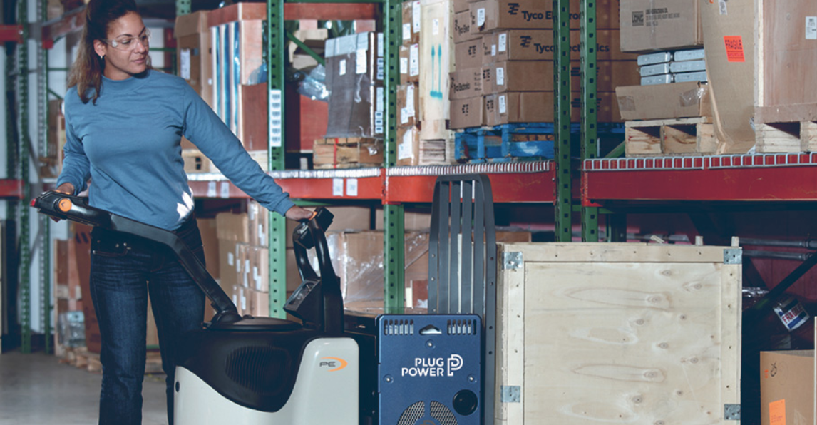 A woman operates material handling equipment power by Plug Power.