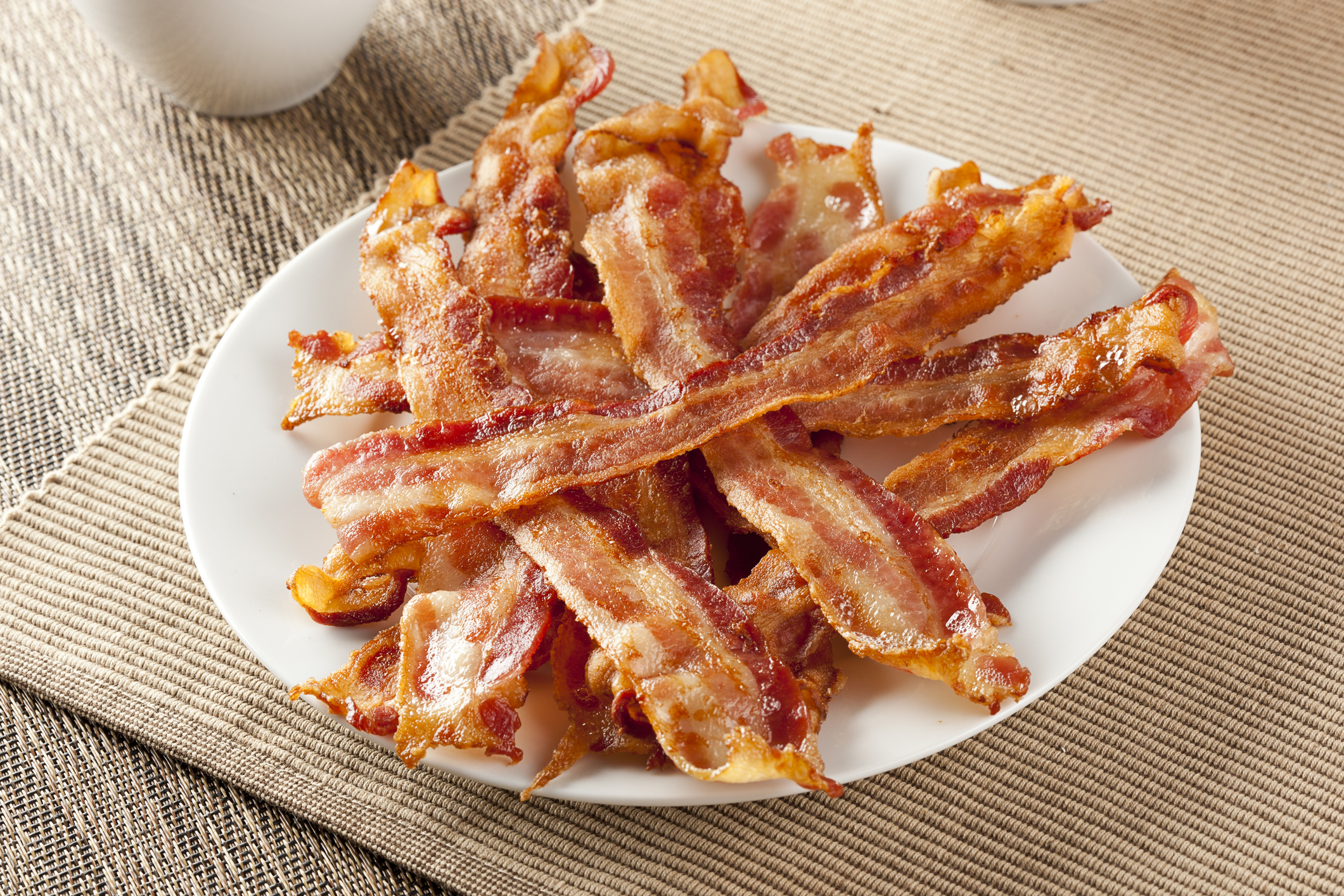 A plate of cooked bacon
