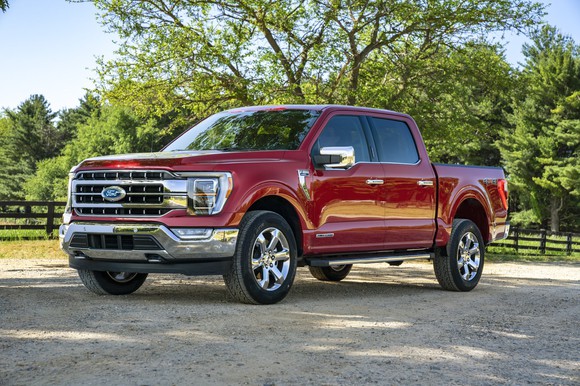 A red 2021 Ford F-150, a full-size pickup truck.