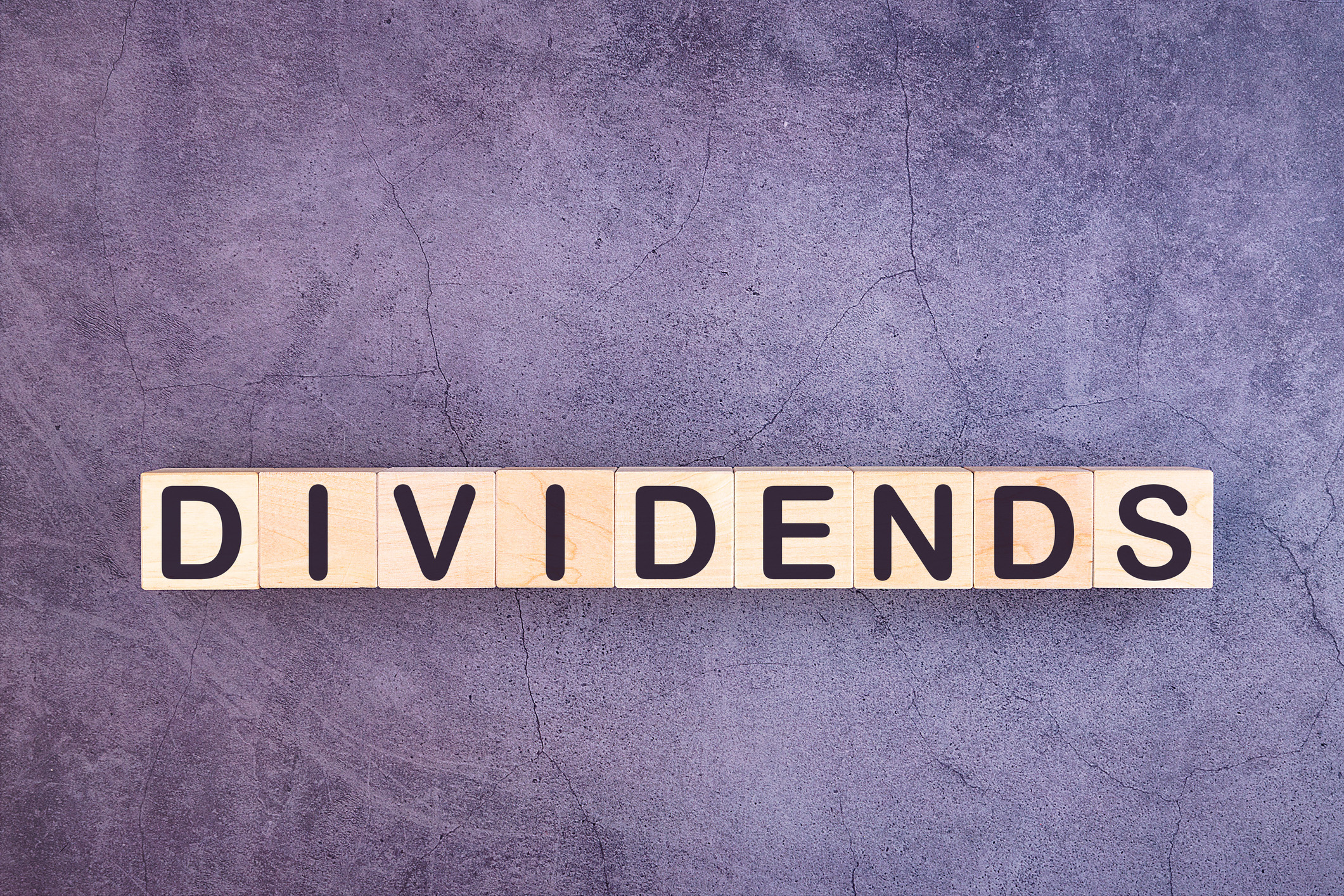 Dividends spelled out inwooden blocks