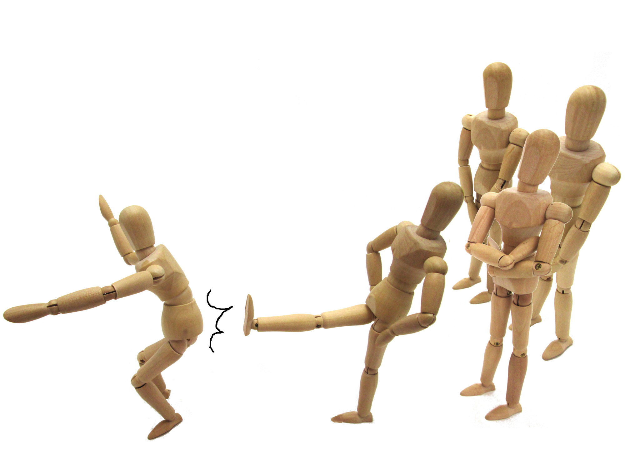 A group of poseable, wooden drawing figures kicking one member out