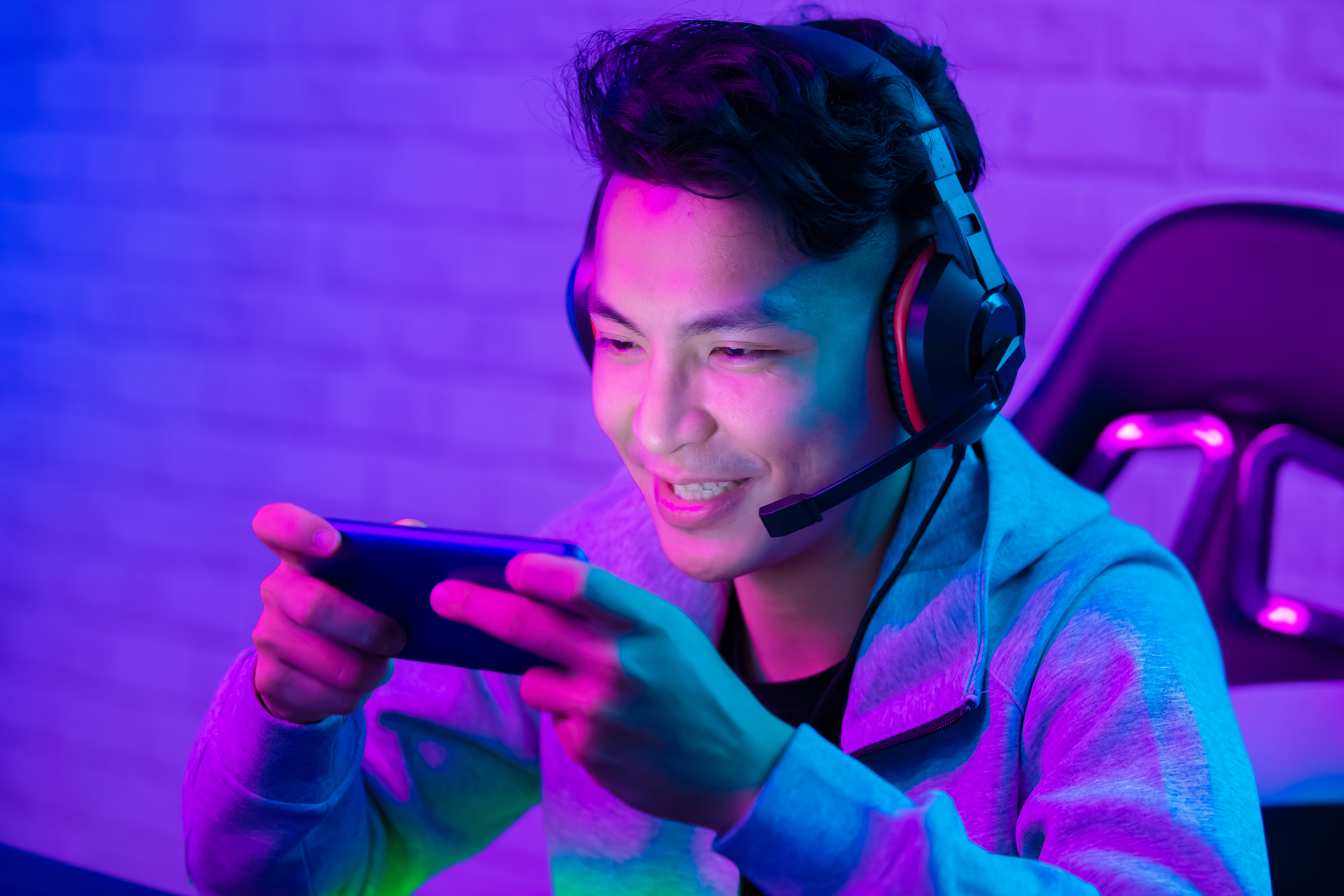 A gamer plays a smartphone game.
