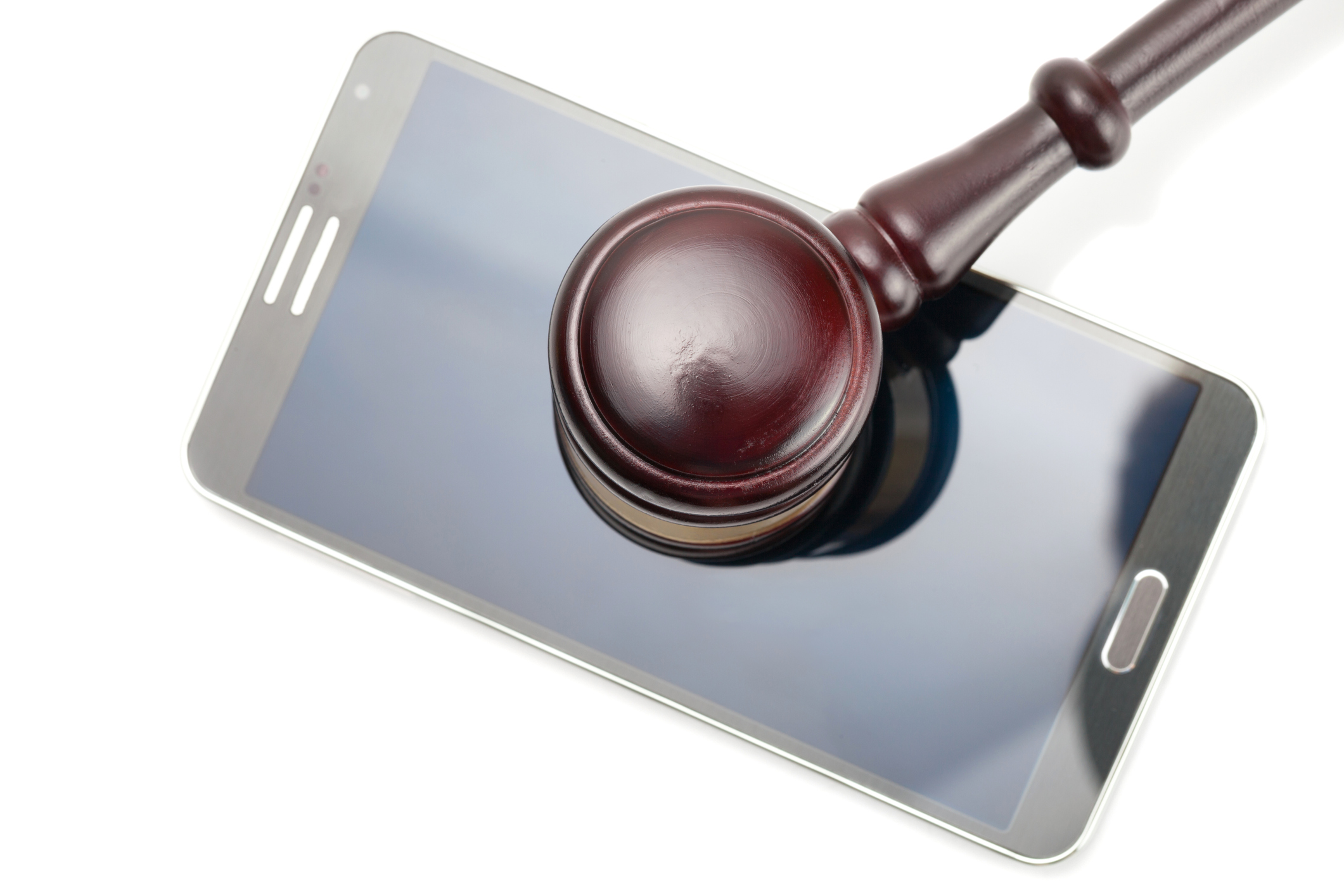 A smartphone under an auctioneer's gavel.