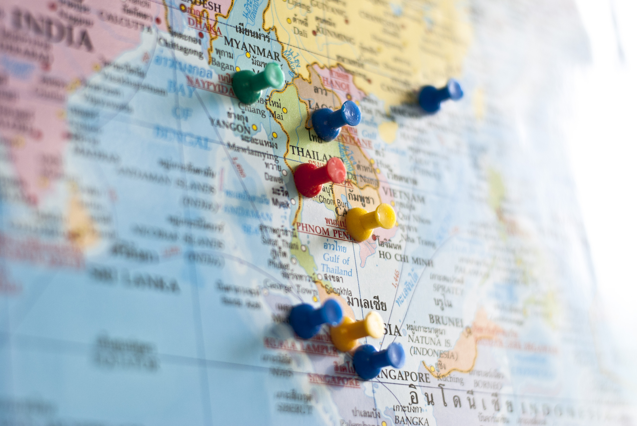 World map with colorful push-pins showing Southeast Asia
