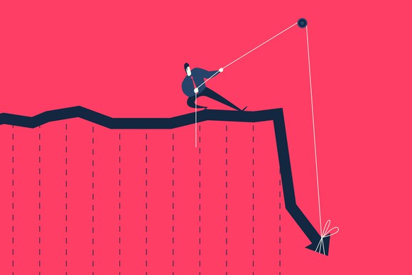 Cartoon man in suit and tie tugging on a pulley to lift up a falling stock chart arrow.