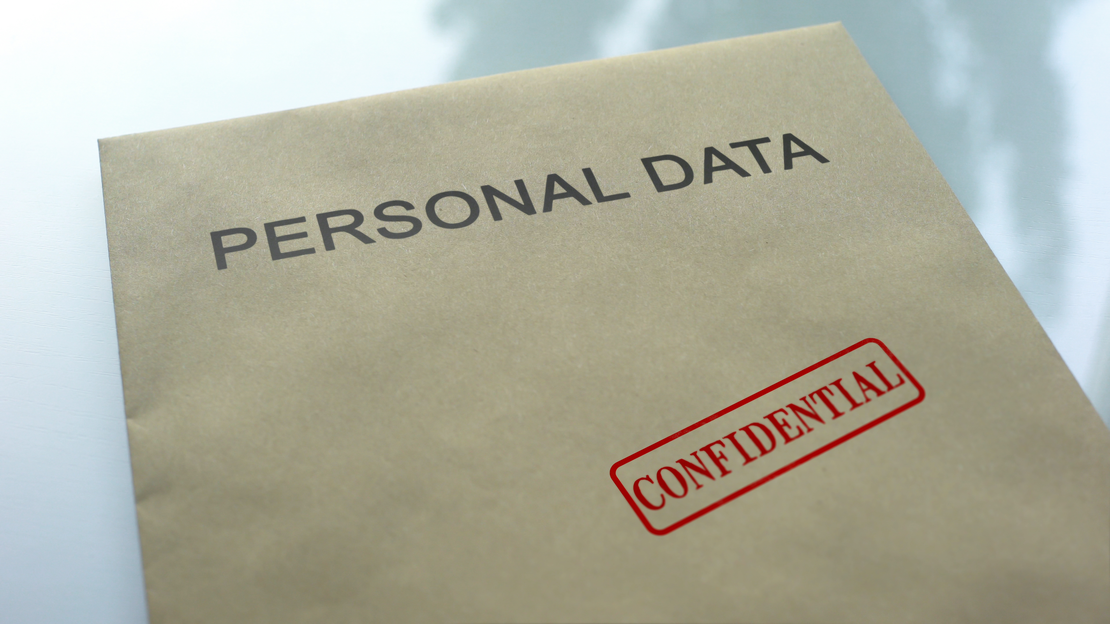 Personal data folder with confidential stamp on it.