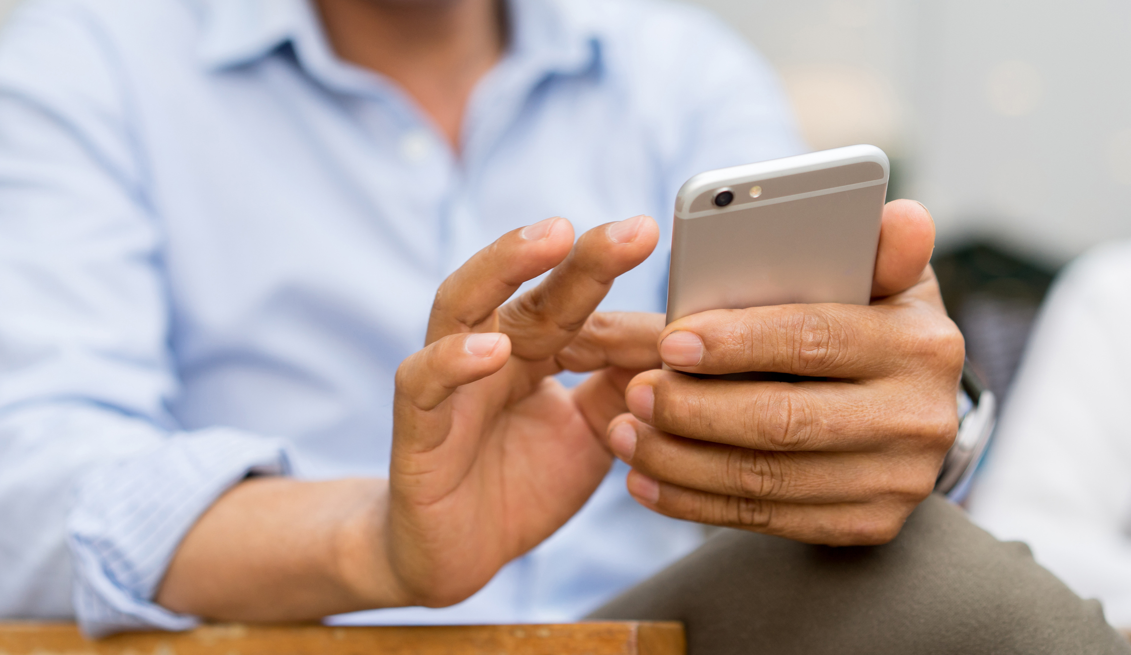 A man holding a smartphone.