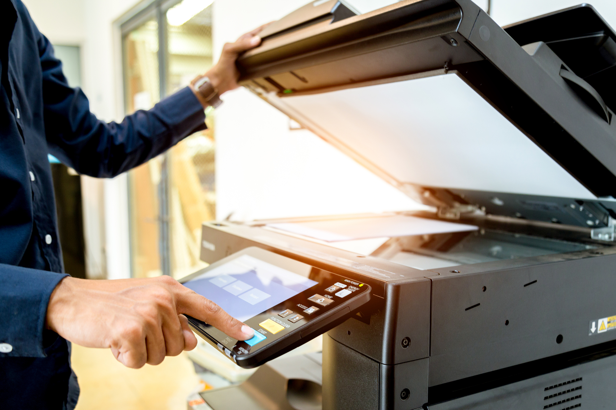 A man using a printer.