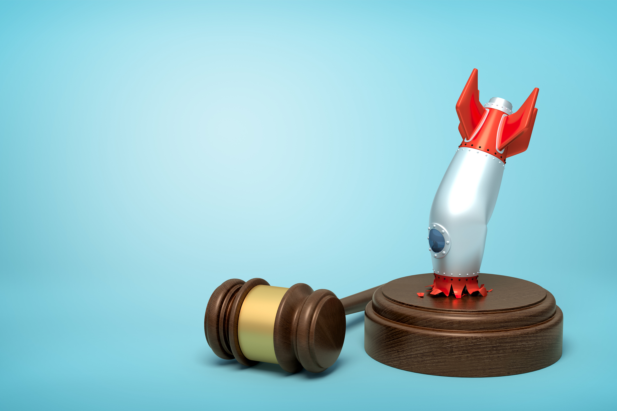 A rocket crashing into the sound block of a wooden gavel.