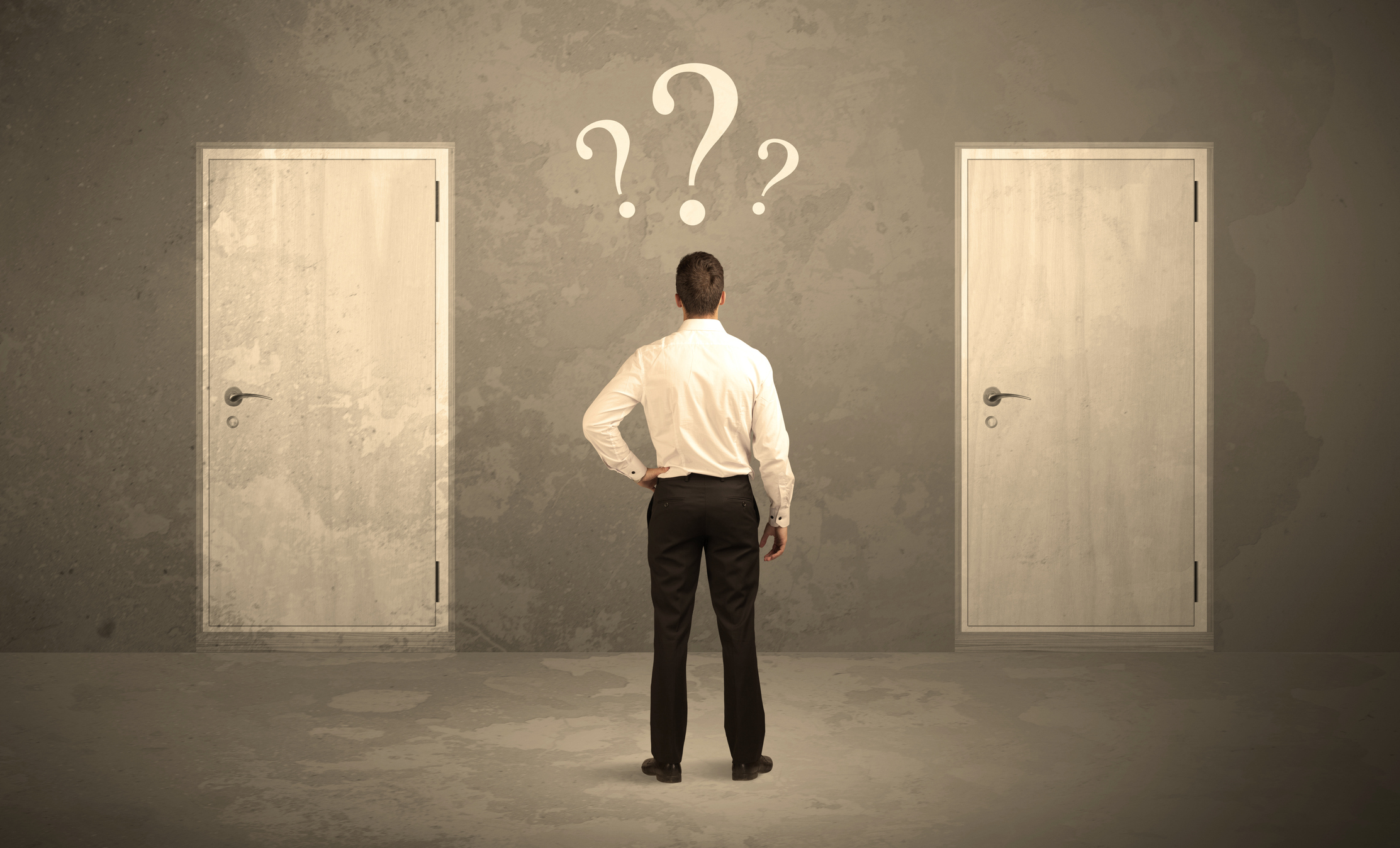 Man standing in front of two doors with question marks hovering above his head.