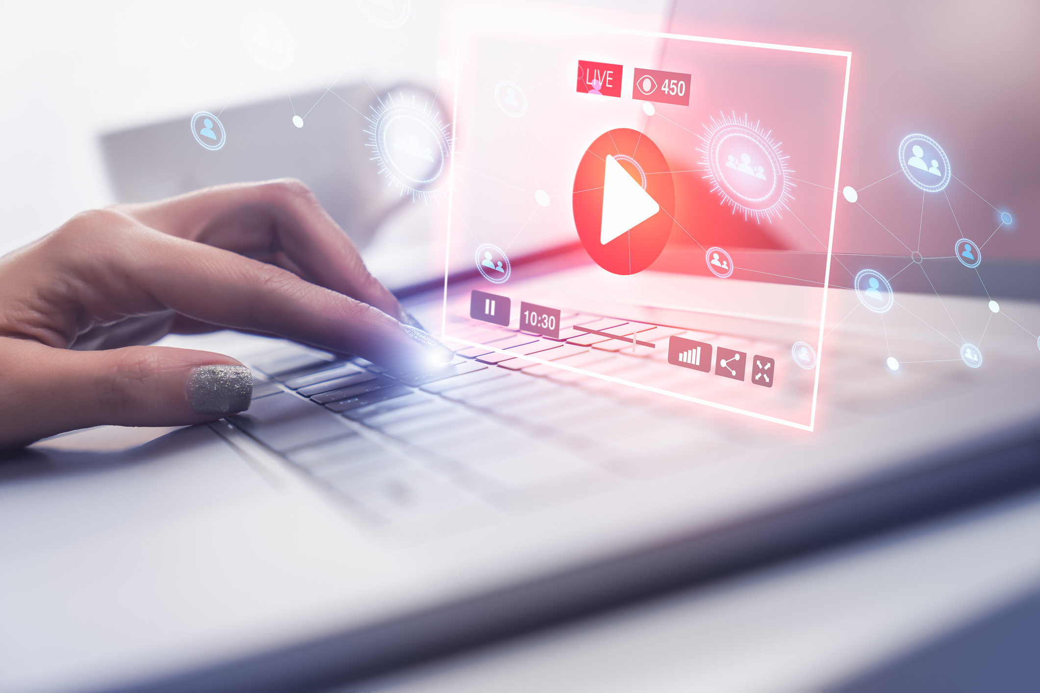 A laptop user plays a streaming video.