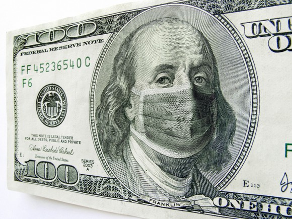 A close up of a $100 bill with Ben Franklin wearing a COVID-19 mask. 