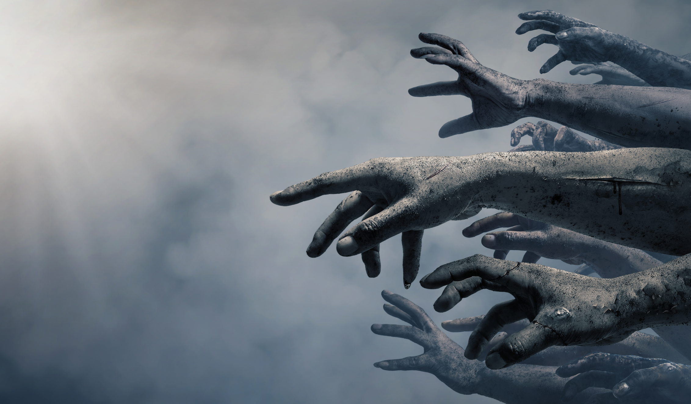 Zombie hands reaching forward.
