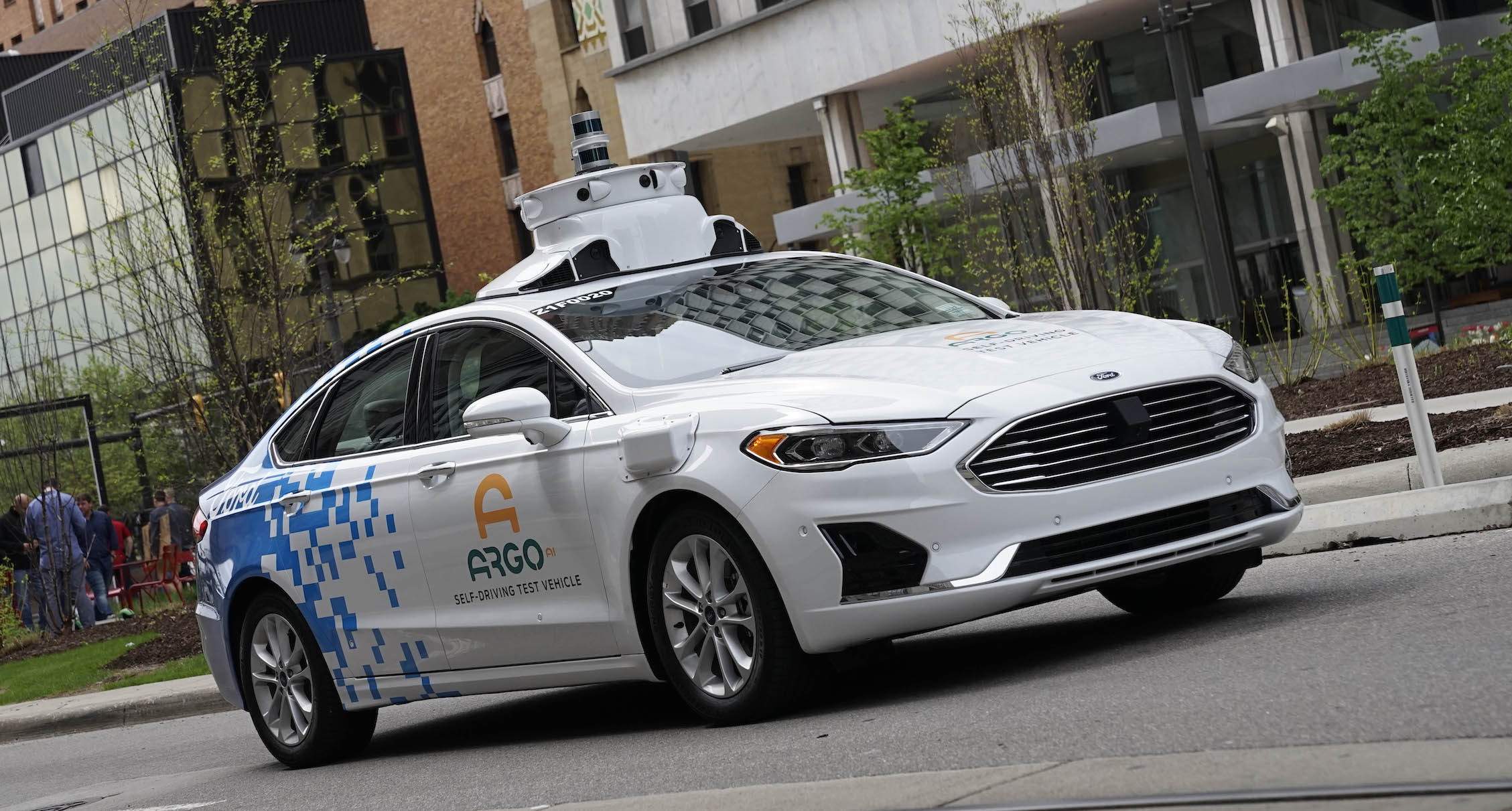 A Ford Fusion with ArgoAI logos and self-driving sensor hardware.