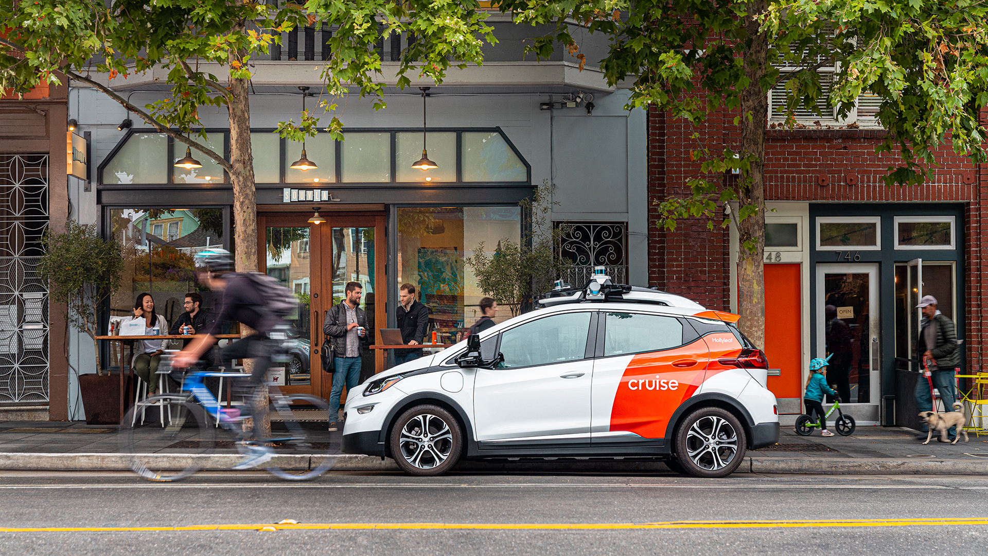 A GM Cruise self-driving taxi prototype on a San Francisco street.