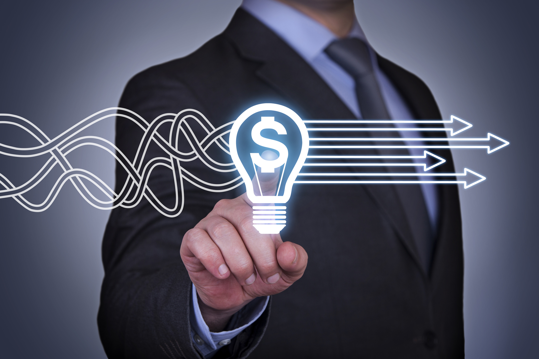 Businessman pointing to an image of a light bulb containing a dollar sign with curvy lines changing into straight lines behind the light bulb