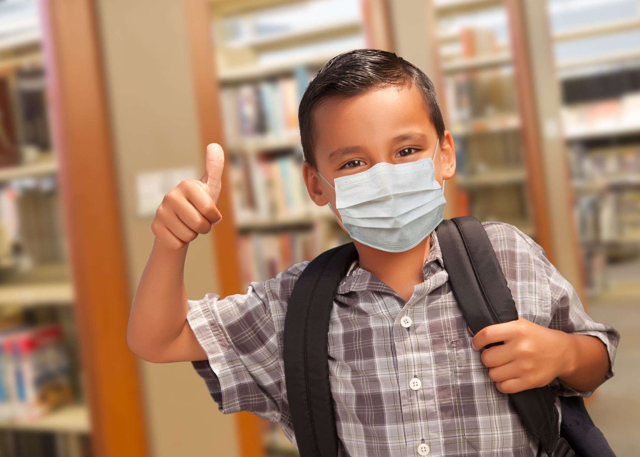 Young student wearing a mask.