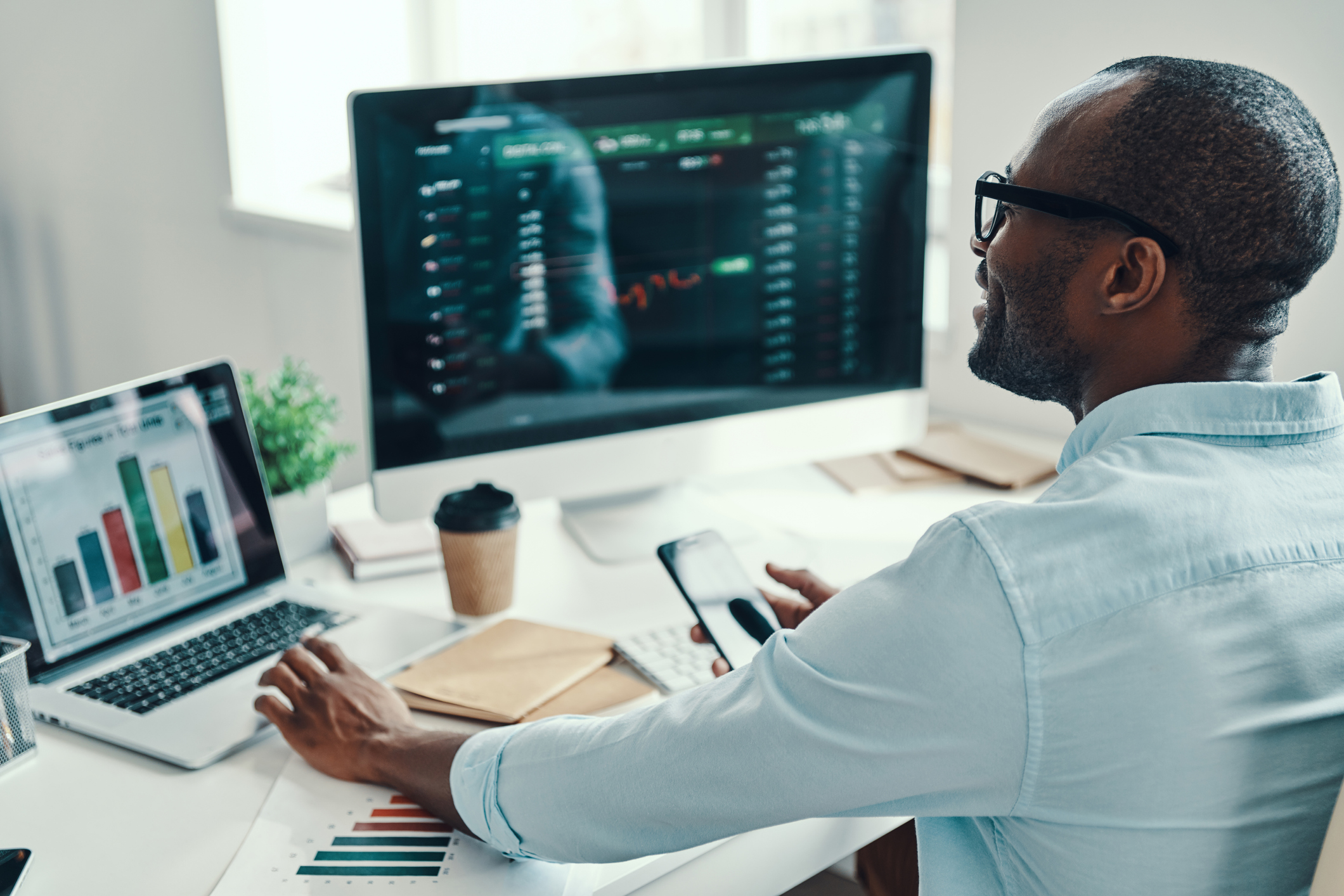 Trading desk with man