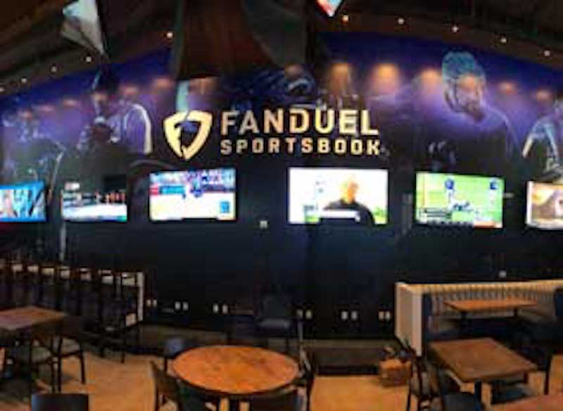 FanDuel logo and TVs showing sports in casino