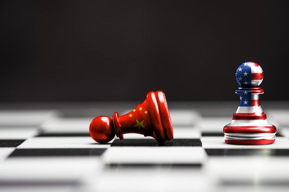 The Chinese flag and American flag painted on chess pawns.