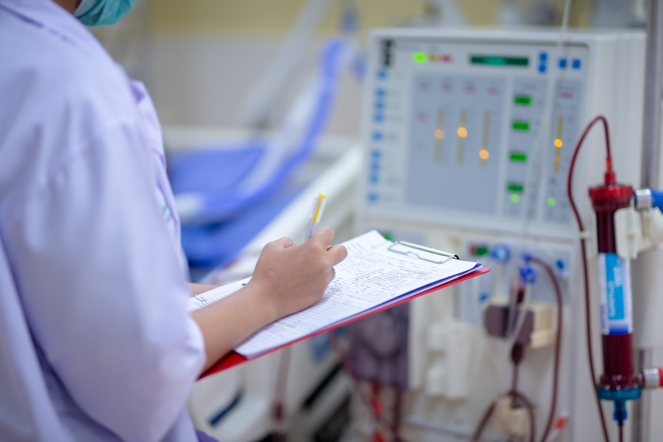Physician in a hospital with a clipboard.