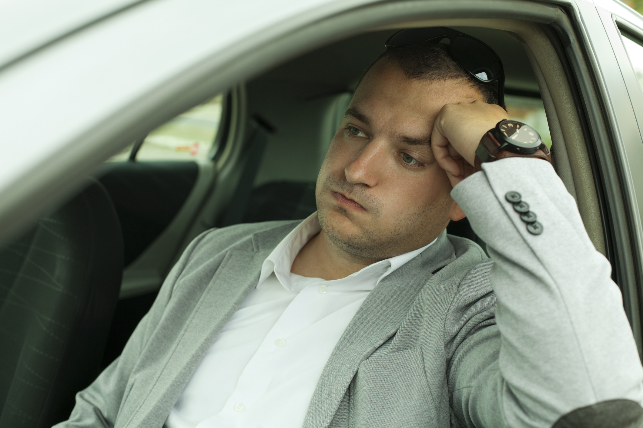 A driver frustrated to be stuck in traffic.