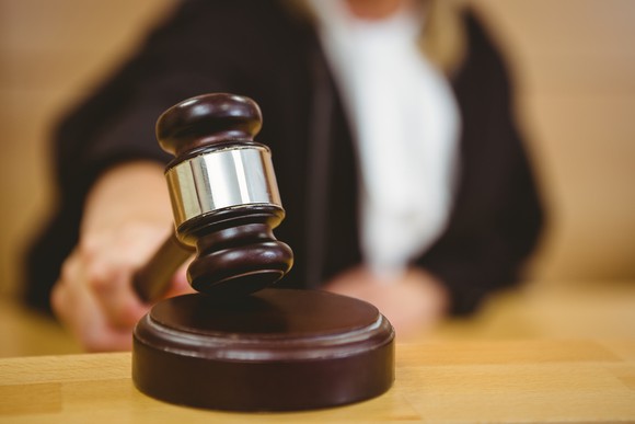 Judge banging a gavel.