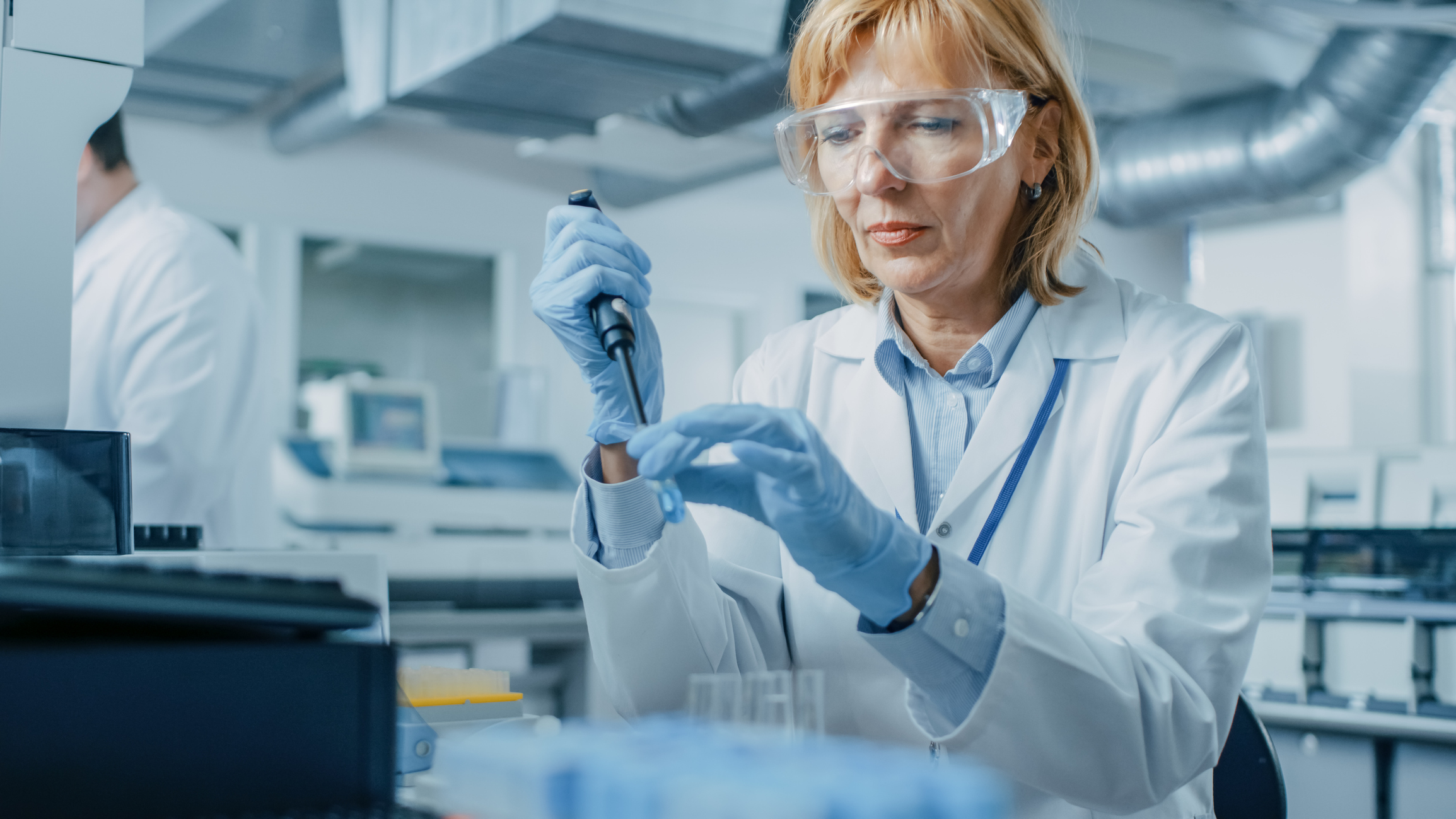 A woman performs clinical research.