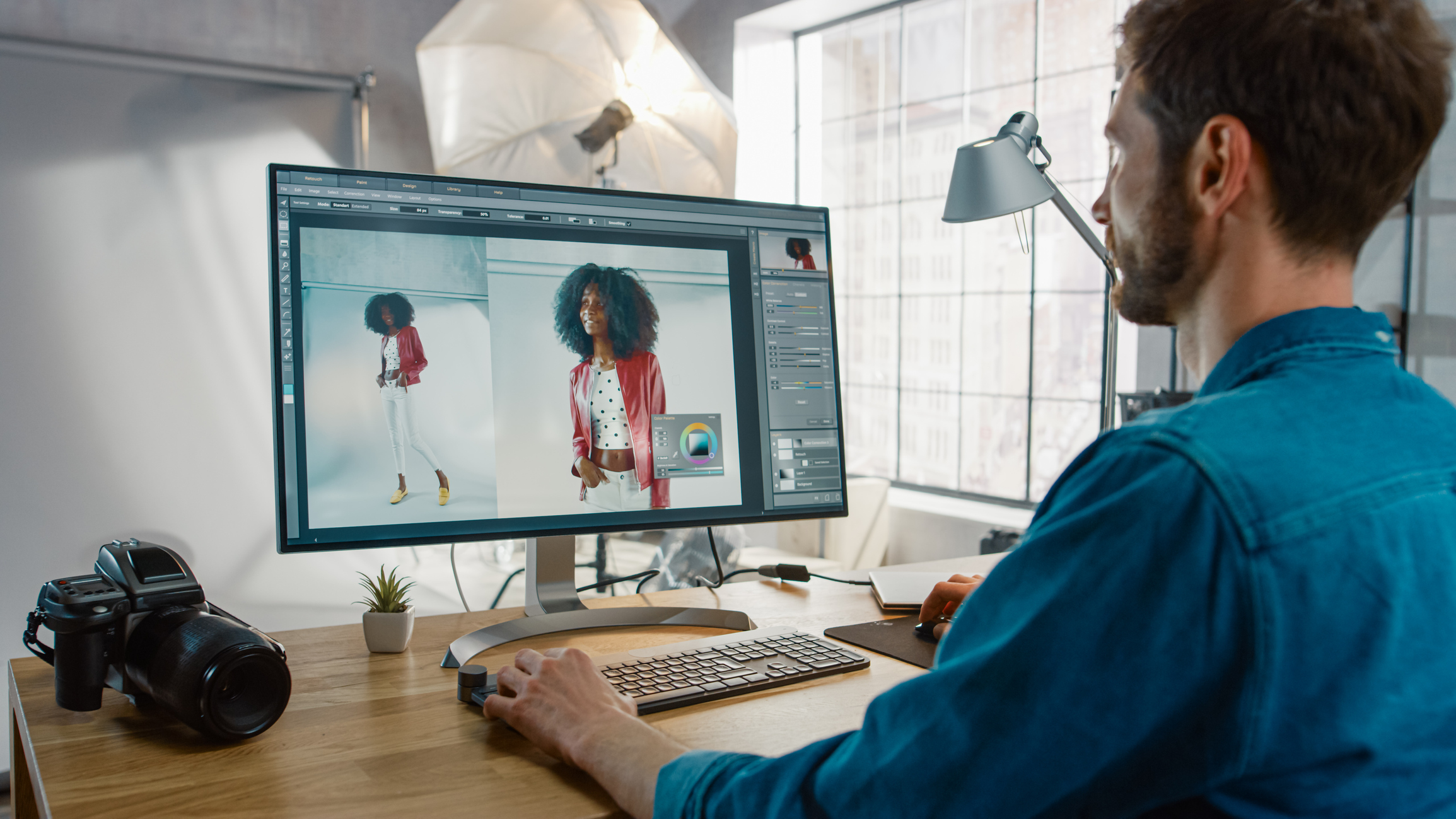 A man edits a photo on a PC.