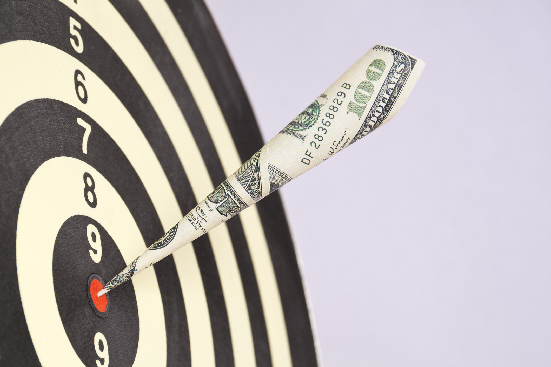 Dollar bill used as a dart