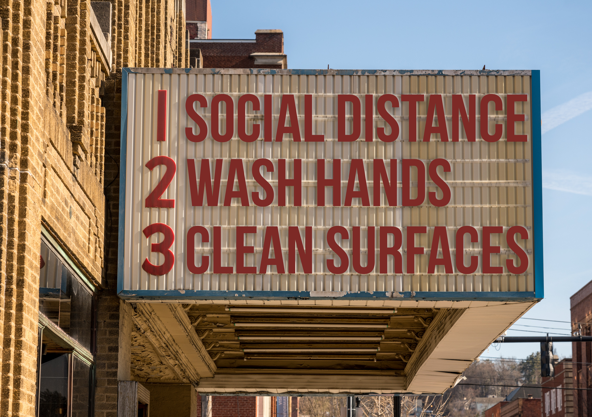 Coronavirus safety protocols on a theater marquee