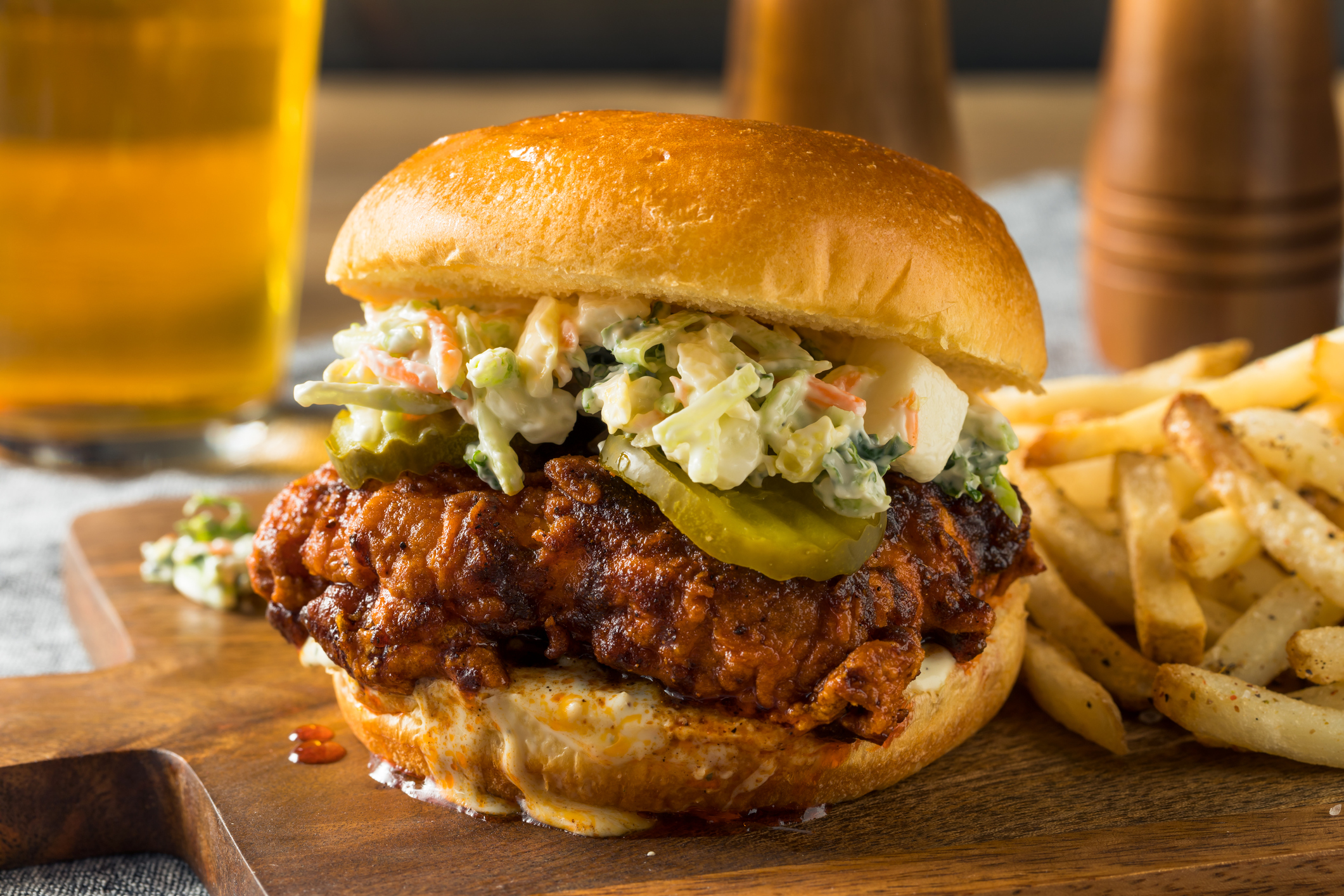 A fried chicken sandwich and french fries.