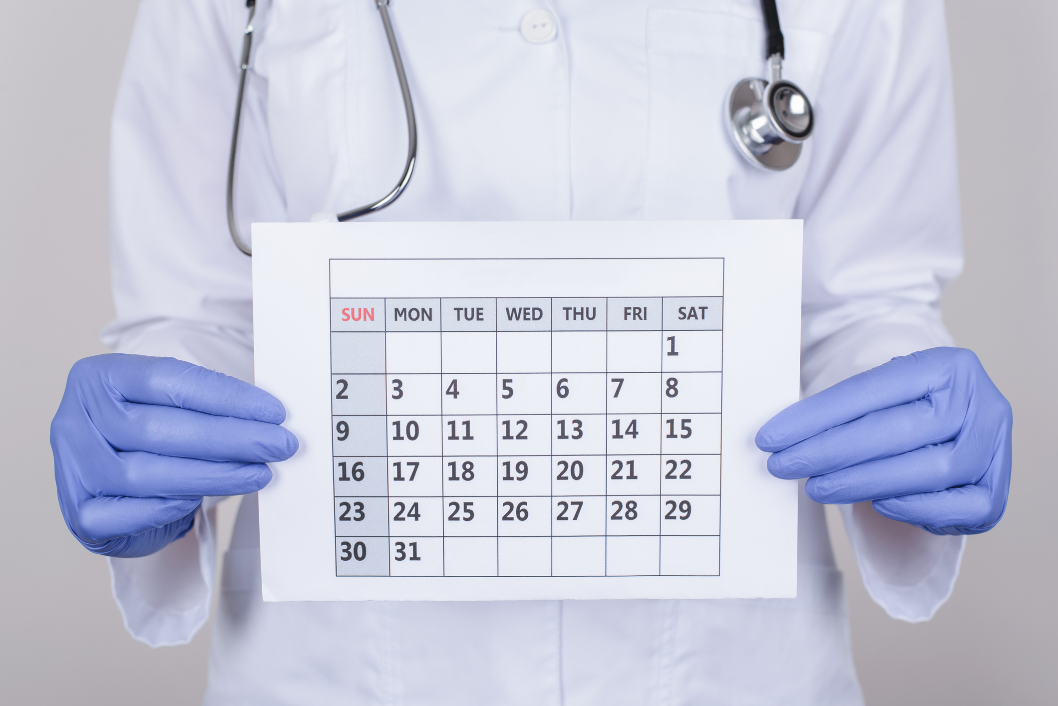 Doctor holding a calendar.