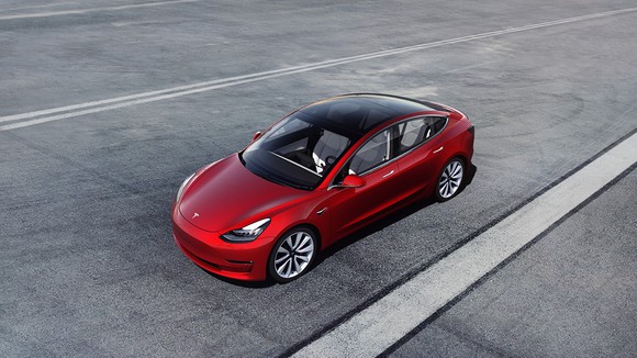 view of red Tesla model 3 from above 