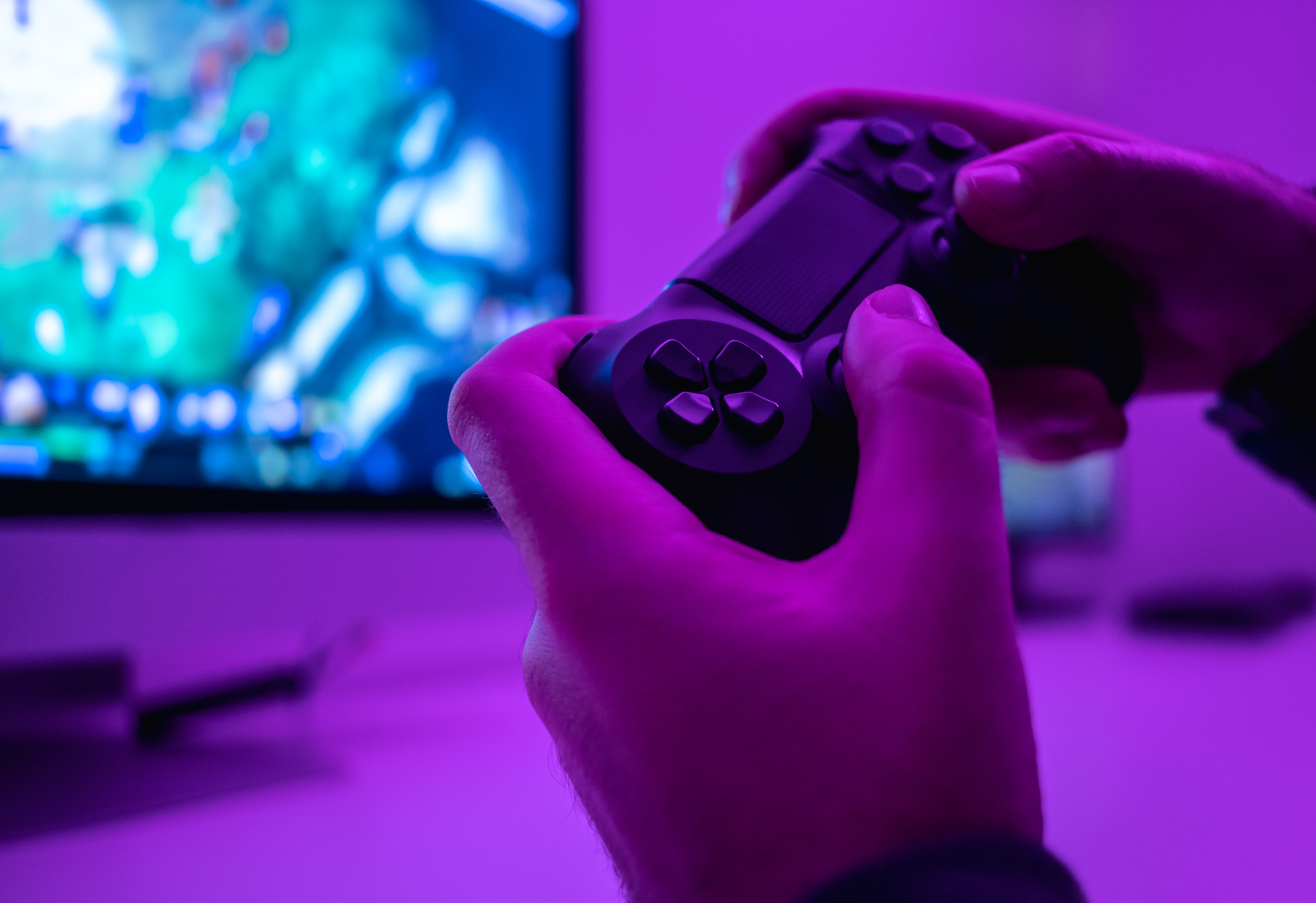 Hands holding a video game controller.
