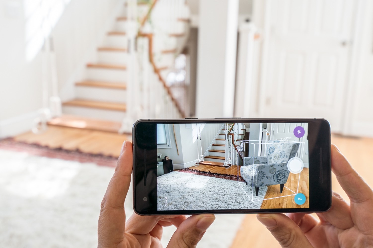 Wayfair's augmented reality tool showing how a chair fits in a room.
